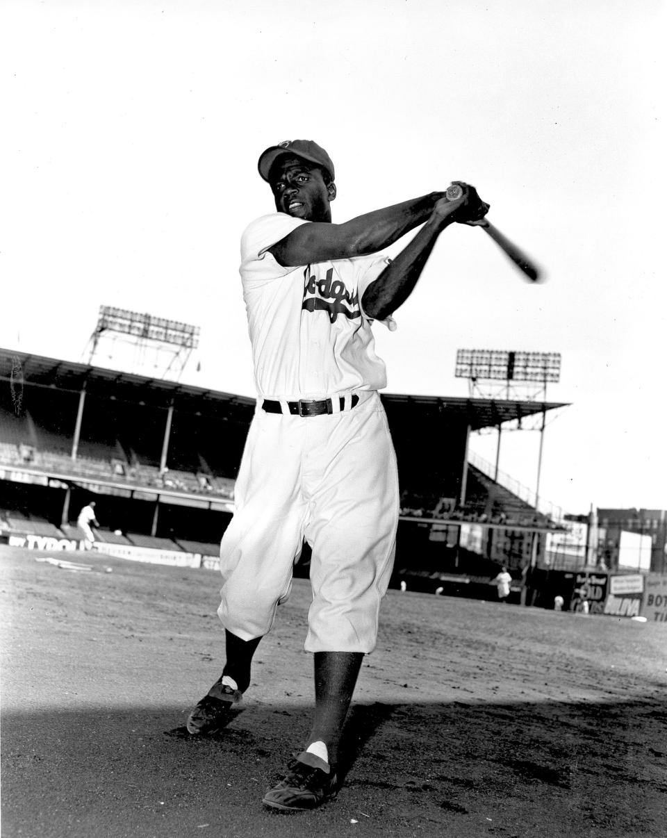 Jackie Robinson, infielder for the Brooklyn Dodgers, swings his bat in this action pose at Ebbett's Field in 1951. A plaque honoring baseball legend Jackie Robinson that was vandalized in Georgia is coming to Kansas City's Negro Leagues Baseball Museum to be put on display.