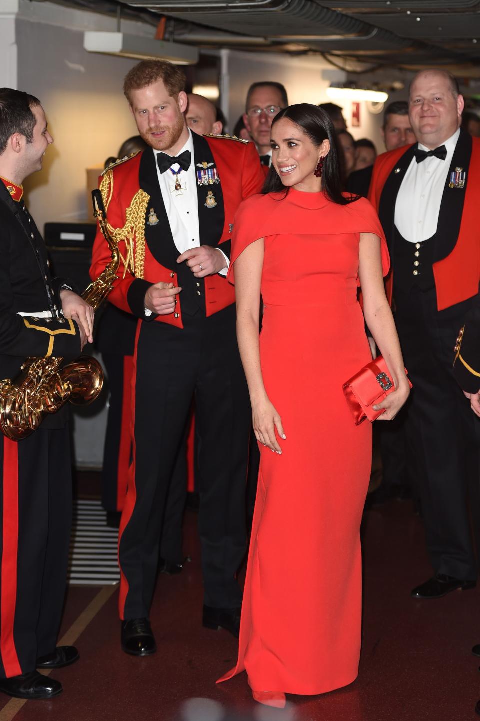 Britain's Prince Harry, Duke of Sussex and Meghan, Duchess of Sussex arrive to attend The Mountbatten Festival of Music at the Royal Albert Hall in London on March 7, 2020. - The Festival brings together world-class musicians, composers and conductors of the Massed Bands of Her Majestys Royal Marines. This year, the performance will mark the 75th anniversary of the end of the Second World War and the 80th anniversary of the formation of Britains Commandos. (Photo by Eddie MULHOLLAND / POOL / AFP) (Photo by EDDIE MULHOLLAND/POOL/AFP via Getty Images)
