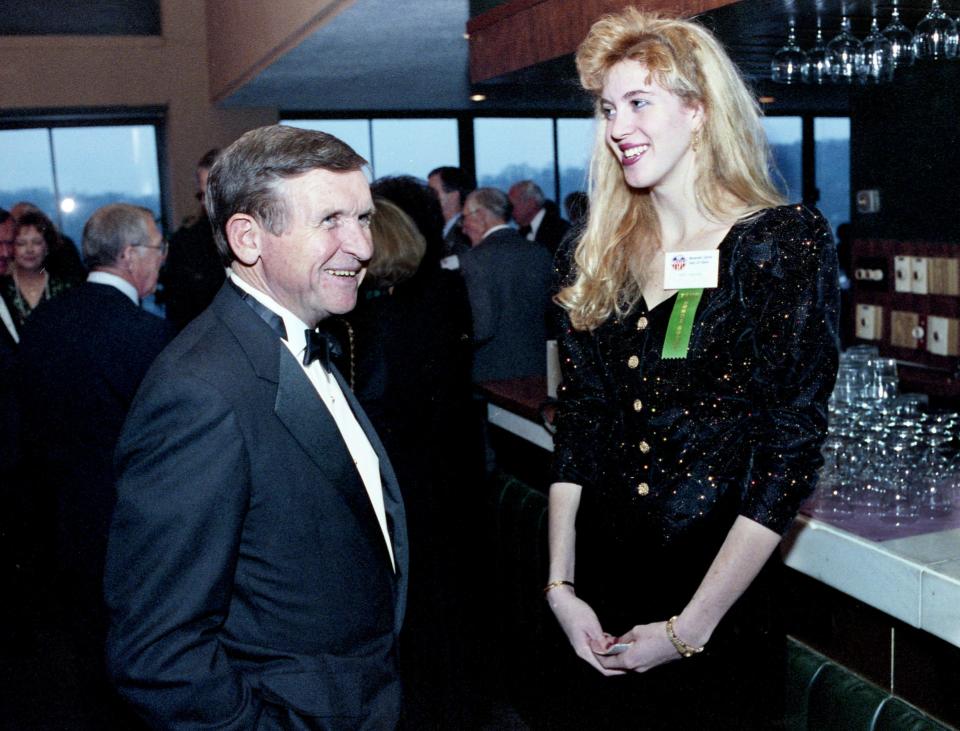 Former Tennessee football coach Johnny Majors, left, and Wendy Scholtens, a former Vanderbilt basketball star, share a moment during the Tennessee Sports Hall of Fame ceremonies in 1991 at the Hyatt Regency in Knoxville. Majors was honored as the Tennessean of the Year and Scholtens was Amateur Athlete of the Year.