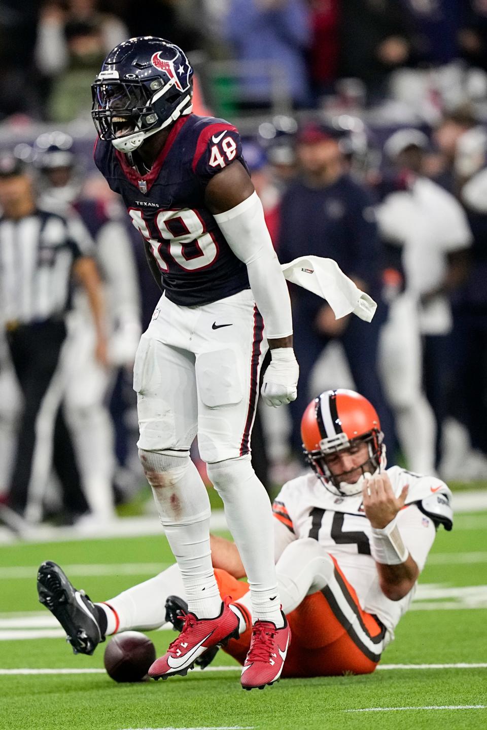 Houston Texans linebacker Christian Harris celebrates after sacking Cleveland Browns quarterback Joe Flacco during the second half Saturday in Houston.