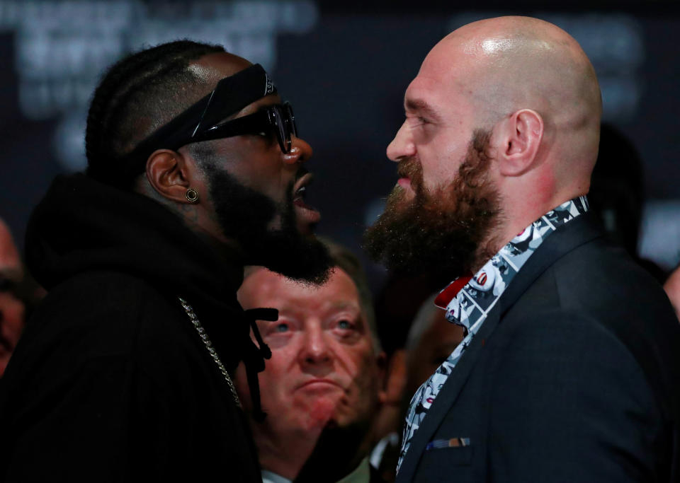 Deontay Wilder and Tyson Fury square up during a news conference Wednesday in Los Angeles before their heavyweight title match Saturday at Staples Center. (Reuters)