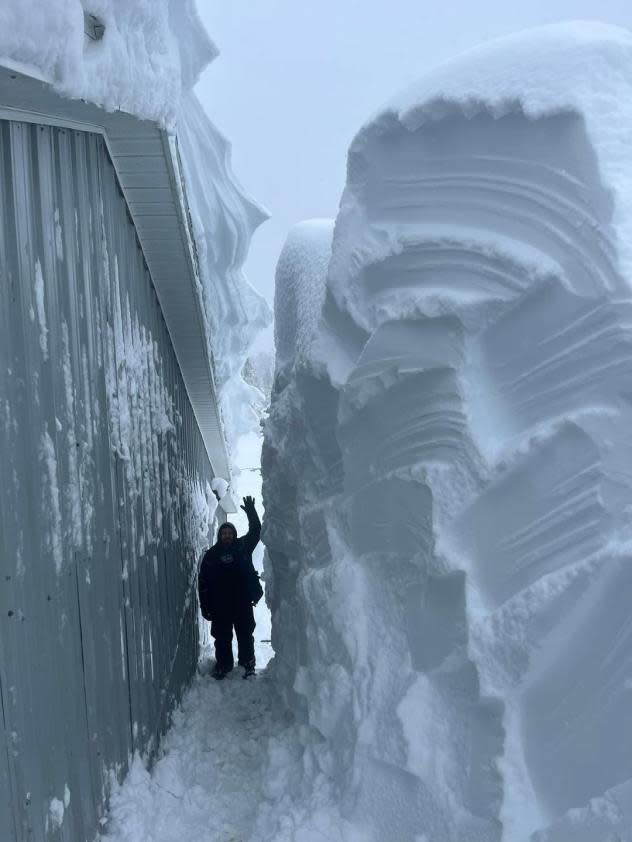 Farmers cut through a huge snow drift after 5 feet of snow in Mira, Nova Scotia, Canada on Feb. 4, 2024. (Dream Stables)