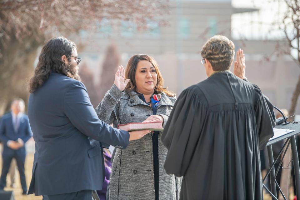 Candace Rivera, center, is sworn in as the new Pueblo County Clerk and Recorder during a ceremony on Jan. 10.