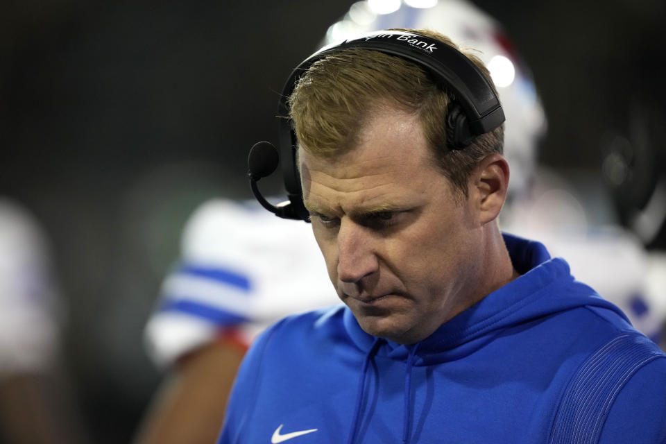 Southern Methodist head coach Rhett Lashlee walks on the sideline during a timeout during the first half of an NCAA college football game against Tulane in New Orleans, Thursday, Nov. 17, 2022. (AP Photo/Gerald Herbert)