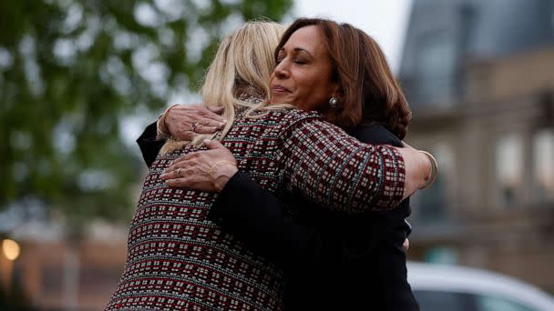 PHOTO: Vice President Kamala Harris hugs Highland Park Mayor Nancy Rotering as she makes a visit to the site of a mass shooting in Highland Park, Ill., July 5, 2022.  (Kamil Krzaczynski/AFP via Getty Images)