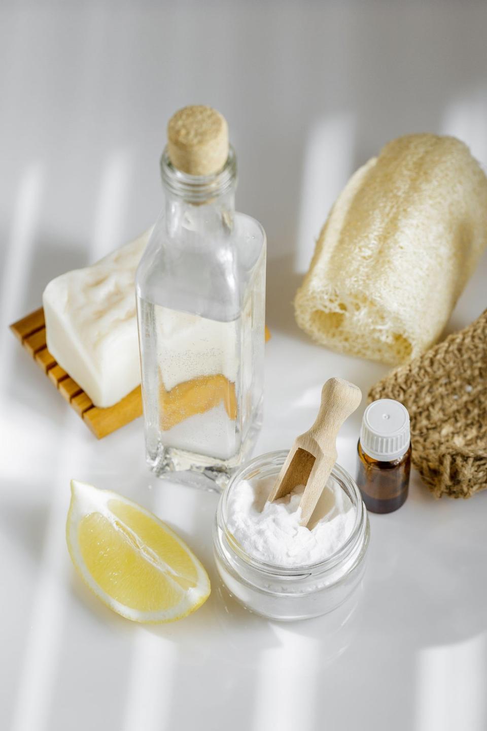 A Generic Photo of white vinegar, baking soda, lemon, aroma oil, plus solid natural soap and a luffa sponge, ready for cleaning. See PA Feature. Picture credit should read: Alamy/PA. WARNING: This picture must only be used to accompany PA Feature HOMES Scent.