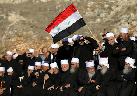 Druze Arabs on the Israeli-occupied Golan Heights hold an anti-election protest outside a municipal polling station in Majdal Shams, October 30, 2018 REUTERS/Ammar Awad