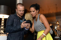 LOS ANGELES, CA - JUNE 21: Actor Aaron Paul (L) and actress Olivia Munn attend the Samsung Galaxy S III Launch held at a private residence on June 21, 2012 in Los Angeles, California. (Photo by Michael Kovac/Getty Images for Samsung)