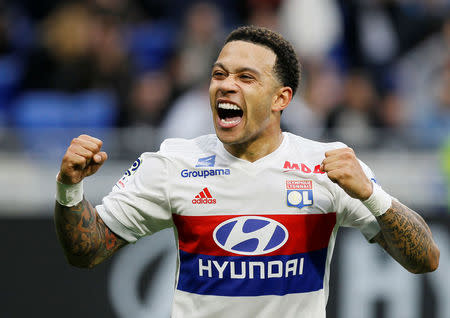 Soccer Football - Ligue 1 - Olympique Lyonnais vs Amiens SC - Groupama Stadium, Lyon, France - April 14, 2018 Lyon's Memphis Depay celebrates scoring their second goal REUTERS/Emmanuel Foudrot