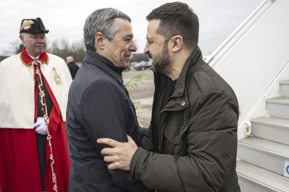 Switzerland's Foreign Minister Federal Councillor Ignazio Cassis, center, welcomes Ukrainian President Volodymyr Zelenskyy upon his arrival at Zurich's Kloten airport, Switzerland, Monday, Jan. 15, 2024. Zelenskyy is in Switzerland to attend the World Economic Forum in Davos starting Tuesday. (Alessandro della Valle/Keystone via AP)