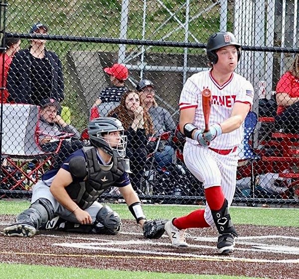 Senior slugger Trent Gombita crushes a pitch during Honesdale's 15-0 romp over Old Forge in a special one-game playoff for the Lackawanna League Division II championship.