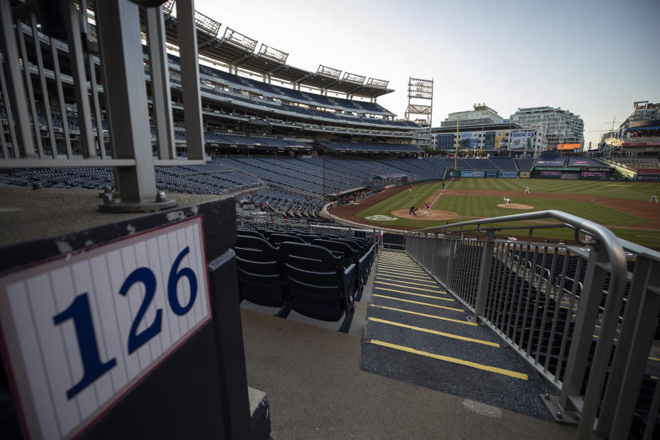 The stands are empty during an exhibition baseball game between the Washington Nationals and the Philadelphia Phillies at Nationals Park, Saturday, July 18, 2020, in Washington. (AP Photo/Alex Brandon)