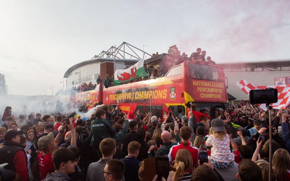 Wrexham players - Ryan Reynolds and Rob McElhenney want Wrexham in the Premier League - Shutterstock/Peter Powell