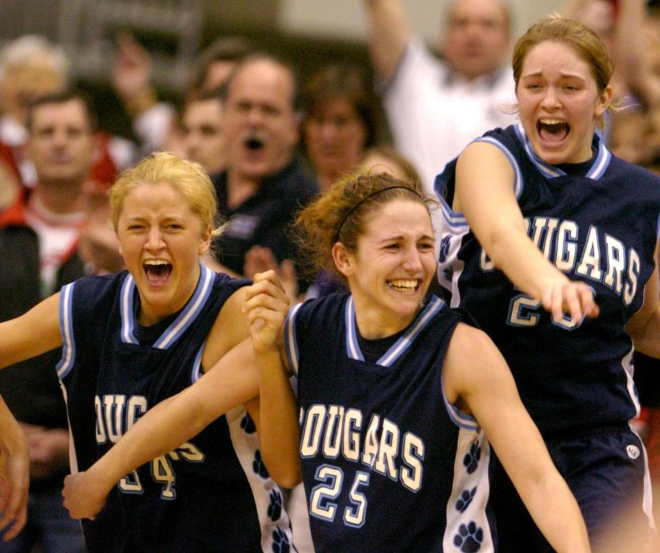 Mount Notre Dame's Mel Thomas, center, averaged 20.4 points per game, 5.4 assists and four rebounds for the Cougars earning the title of Ohio Ms. Basketball in 2004.
