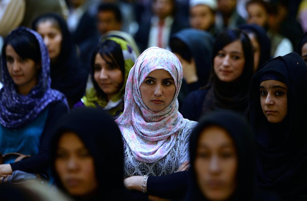 <span class="caption">Audience members listen to Afghan parliamentarian Fawzia Koofi speak in 2014. Women's access to politics increased greatly after the Taliban's 2001 ouster.</span> <span class="attribution"><a class="link " href="https://www.gettyimages.com/detail/news-photo/afghan-women-listen-to-a-speaker-address-a-political-news-photo/181903098" rel="nofollow noopener" target="_blank" data-ylk="slk:Sha Marai/AFP via Getty Images;elm:context_link;itc:0;sec:content-canvas">Sha Marai/AFP via Getty Images</a></span>