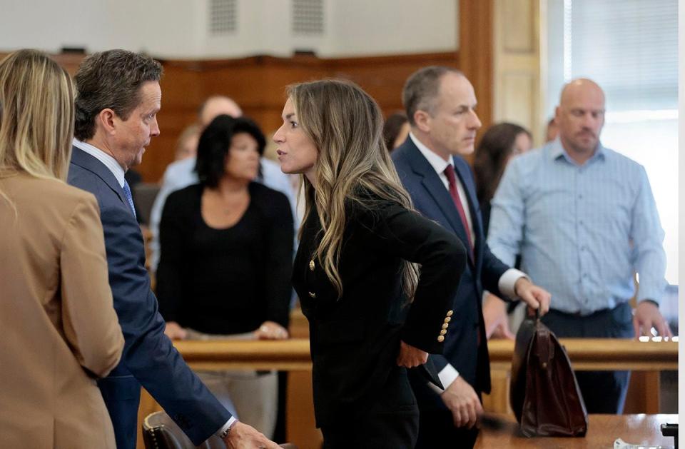 Karen Read speaks with her attorney, Alan Jackson as the jury leaves the courtroom to start their third day of deliberations, in her murder trial, in Norfolk Superior Court on Thursday, June 27, 2024 in Dedham, Mass. Read is on trial, accused of killing her boyfriend Boston police Officer John O'Keefe, in 2022. (Pat Greenhouse/The Boston Globe via AP, Pool)