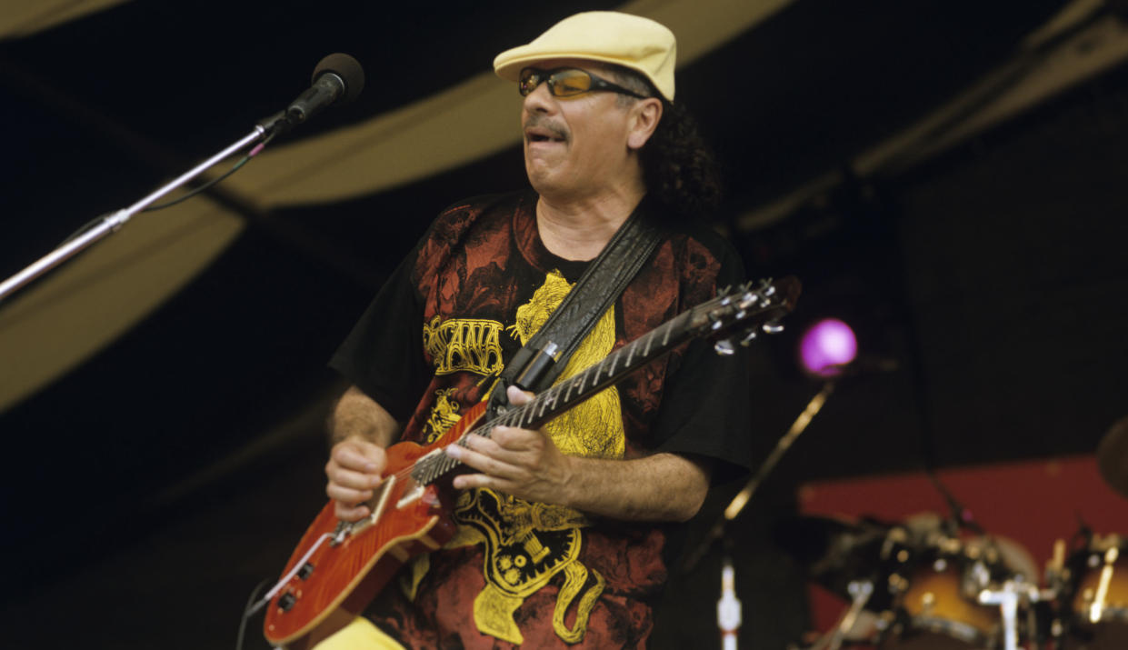  Carlos Santana performs live onstage at the New Orleans Jazz & Heritage Festival in New Orleans, Louisiana on April 24, 1999. 