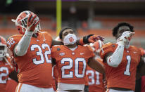 Clemson defensive tackle Etinosa Reuben (32), cornerback LeAnthony Williams (20), and cornerback Derion Kendrick (1) sing the alma mater after an NCAA college football game against Boston College Saturday, Oct. 31, 2020, in Clemson, S.C. (Josh Morgan/Pool Photo via AP)