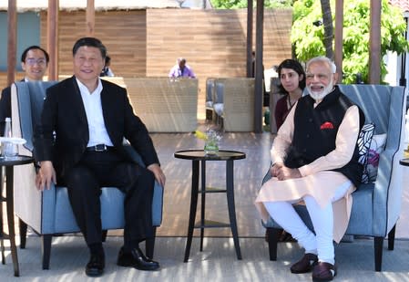 India's Prime Minister Modi and China's President Xi look on during their meeting in Mamallapuram