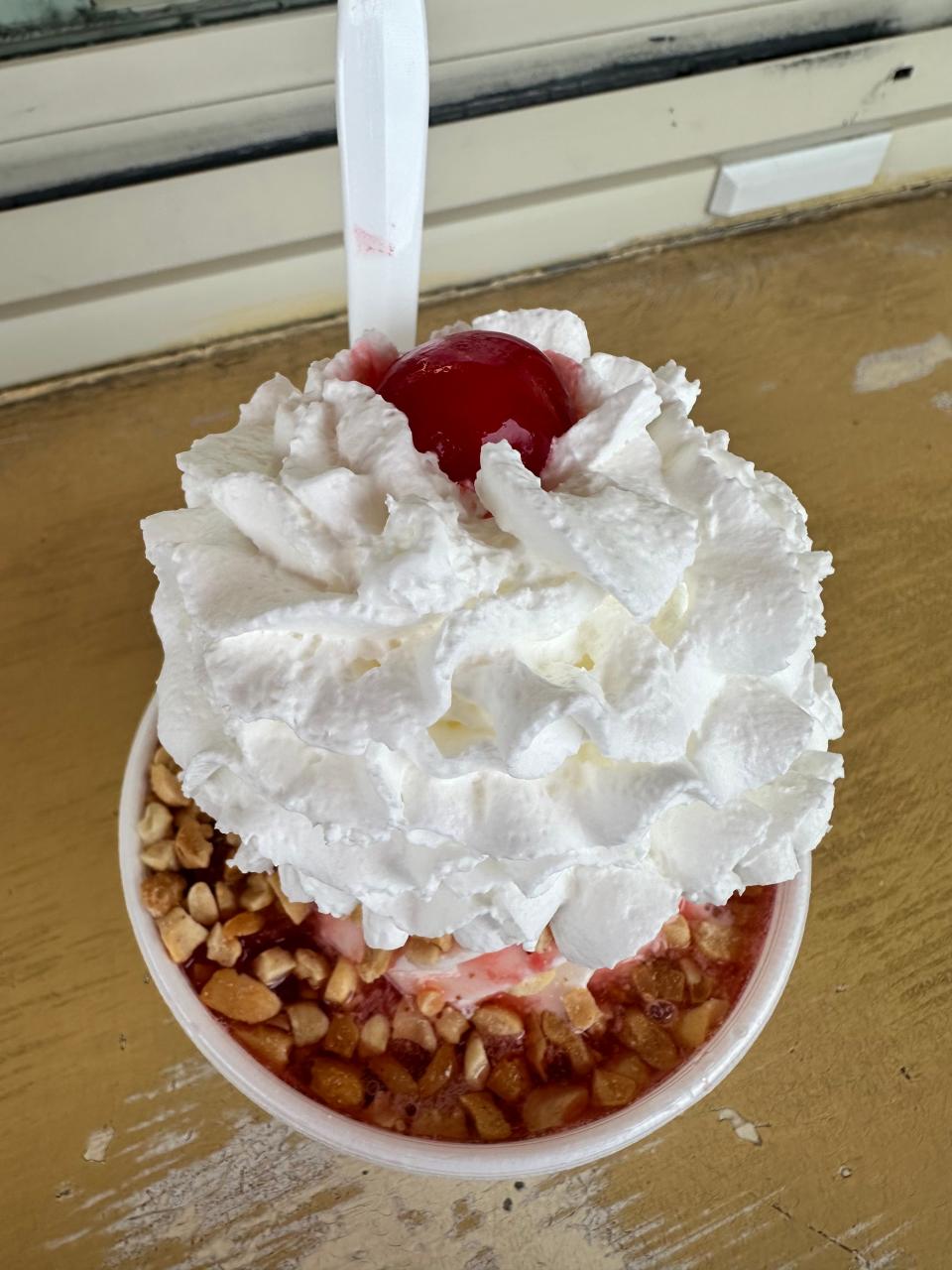 A classic strawberry sundae with chopped nuts and whipped cream served at Twistee Treats in Massillon. All with a cherry on top!