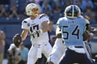 Los Angeles Chargers quarterback Philip Rivers (17) passes as he is pressured by Tennessee Titans inside linebacker Rashaan Evans (54) in the first half of an NFL football game Sunday, Oct. 20, 2019, in Nashville, Tenn. (AP Photo/Mark Zaleski)