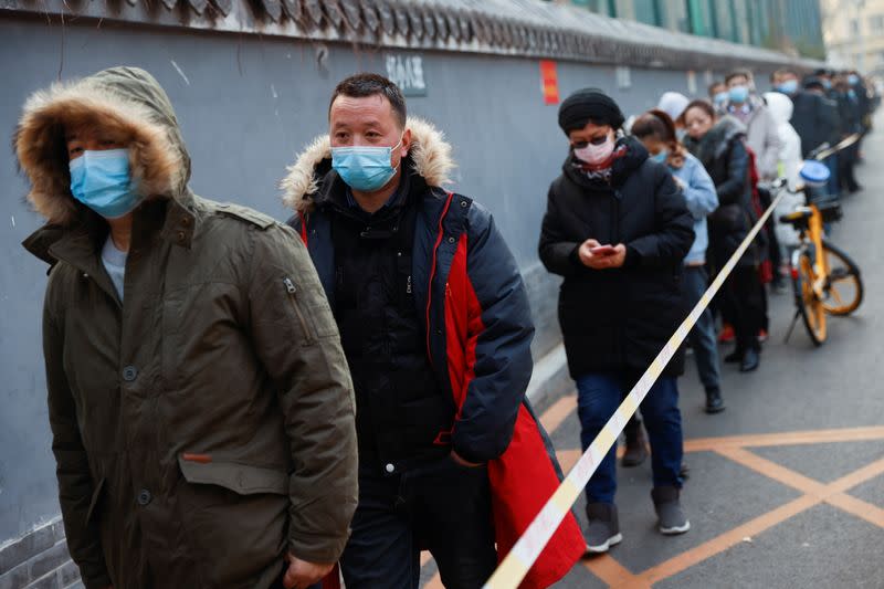 People line up to get their nucleic acid test following the outbreak of the coronavirus disease (COVID-19) in Beijing