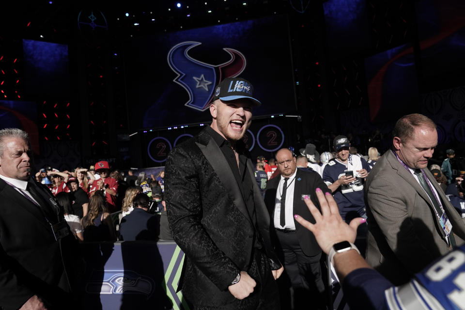 Michigan defensive end Aidan Hutchinson celebrates after being selected by the Detroit Lions as the second pick in the NFL football draft Thursday, April 28, 2022, in Las Vegas. (AP Photo/Jae C. Hong)