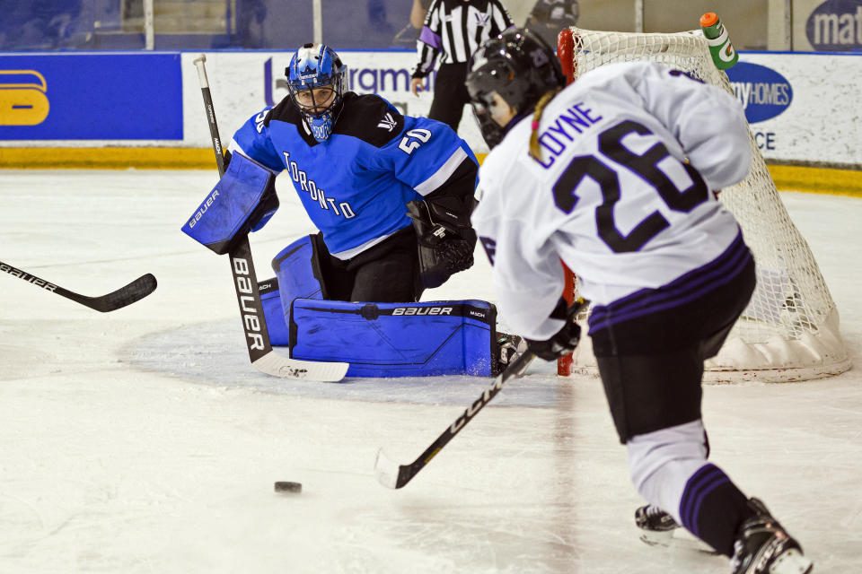 Minnesota forward Kendall Coyne Schofield (26) shoots on Toronto goaltender Kristen Campbell (50) during the first period of a PWHL hockey game in Toronto, Ontario, Saturday, Feb. 3, 2024. (Christopher Katsarov/The Canadian Press via AP)