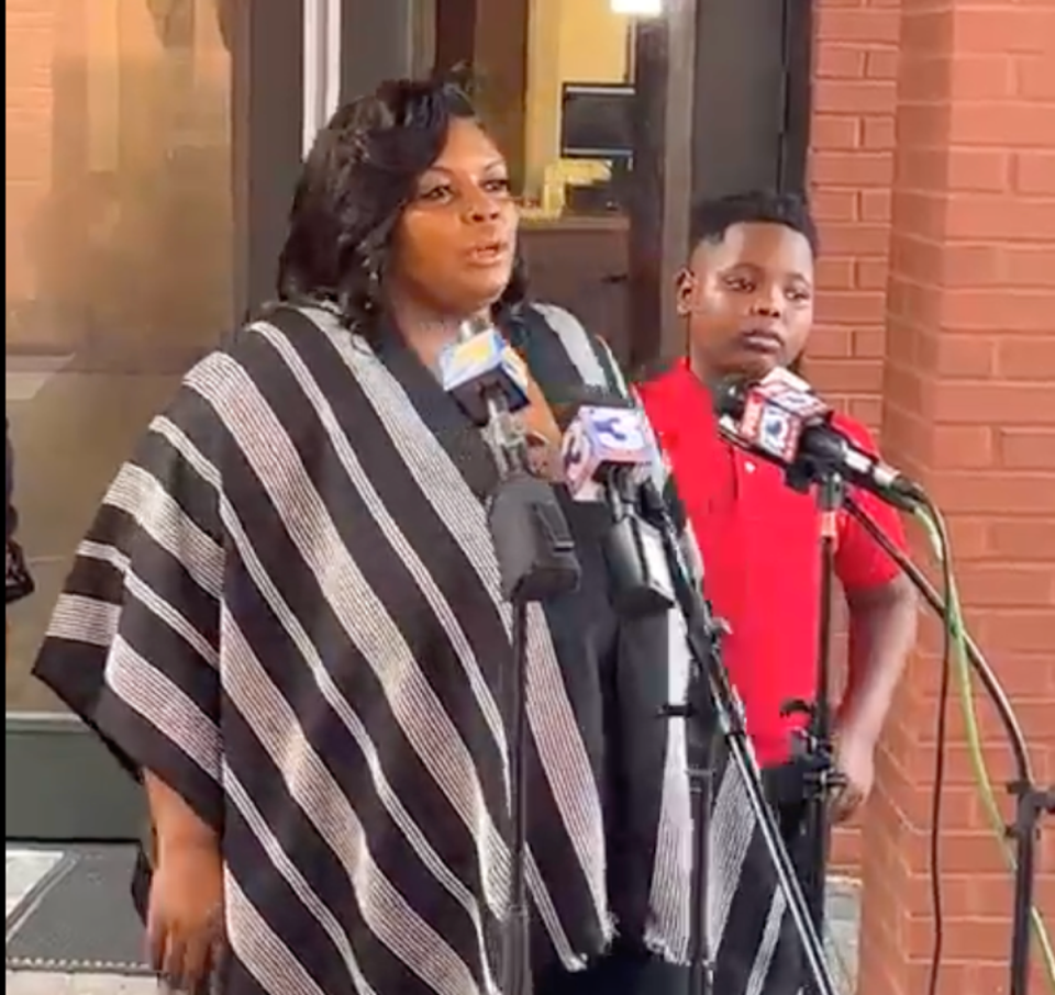 LaTonya Eason with her son Quantavious at a news conference on Wednesday (Carlos Moore / Facebook)