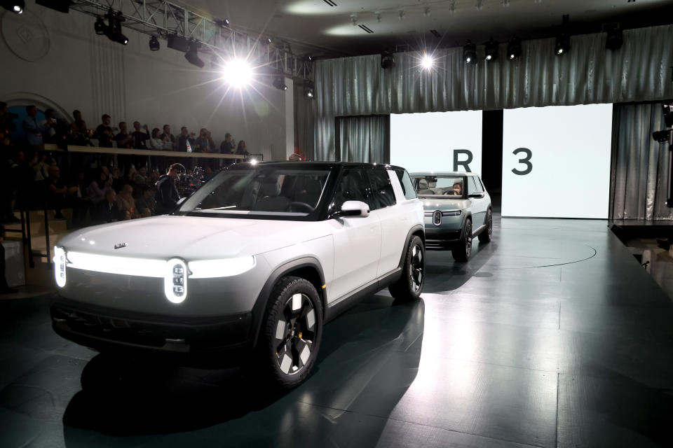 LAGUNA BEACH, CALIFORNIA - MARCH 07: The Rivian R3 SUV is displayed during the Rivian Reveals All-Electric R2 Midsize SUV event at the Rivian South Coast Theater on March 07, 2024 in Laguna Beach, California.  (Photo by Phillip Faraone/Getty Images for Rivian)