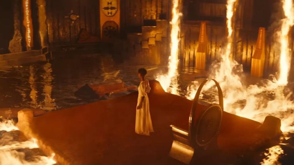 Shuri watches flames consume Wakanda's throne room in the Ancestral Plane in Black Panther: Wakanda Forever