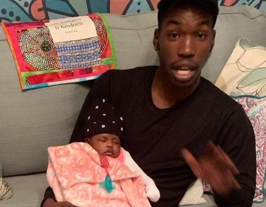 Karon Hylton and his months-old daughter.  / Credit: WUSA-TV