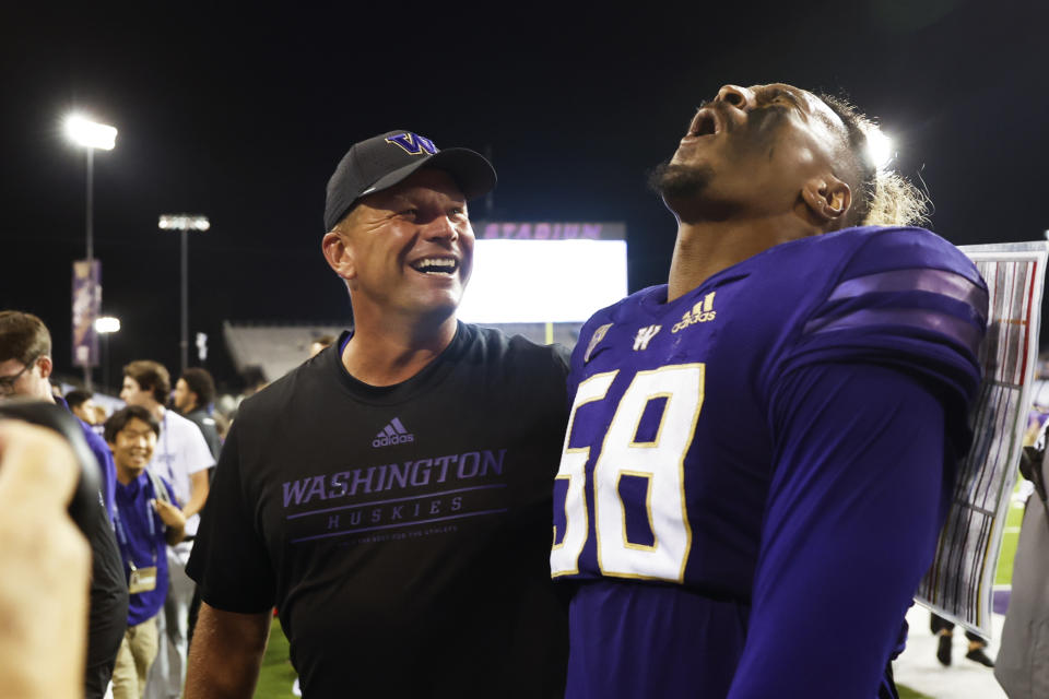 Sep 3, 2022; Seattle, Washington, USA; Washington Huskies head coach Kalen DeBoer hugs defensive lineman Zion Tupuola-Fetui (58) following a 45-20 Washington victory against the Kent State Golden Flashes at Alaska Airlines Field at Husky Stadium. Mandatory Credit: Joe Nicholson-USA TODAY Sports