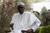 All Progressives Congresses presidential candidate and Nigeria's former military ruler Muhammodu Buhari addresses a news conference outside his house after he voted in Daura, March 28, 2015. REUTERS/Akintunde Akinleye