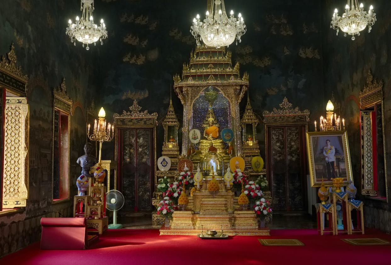 A prayer altar in the main gathering hall at the temple Wat Ratchapradit in Bangkok, Thailand. <a href="https://www.gettyimages.com/detail/news-photo/prayer-shrine-at-wat-ratchapradit-in-bangkok-thailand-a-news-photo/1485121746?adppopup=true" rel="nofollow noopener" target="_blank" data-ylk="slk:Pictures from History/Universal Images Group via Getty Images;elm:context_link;itc:0;sec:content-canvas" class="link ">Pictures from History/Universal Images Group via Getty Images</a>