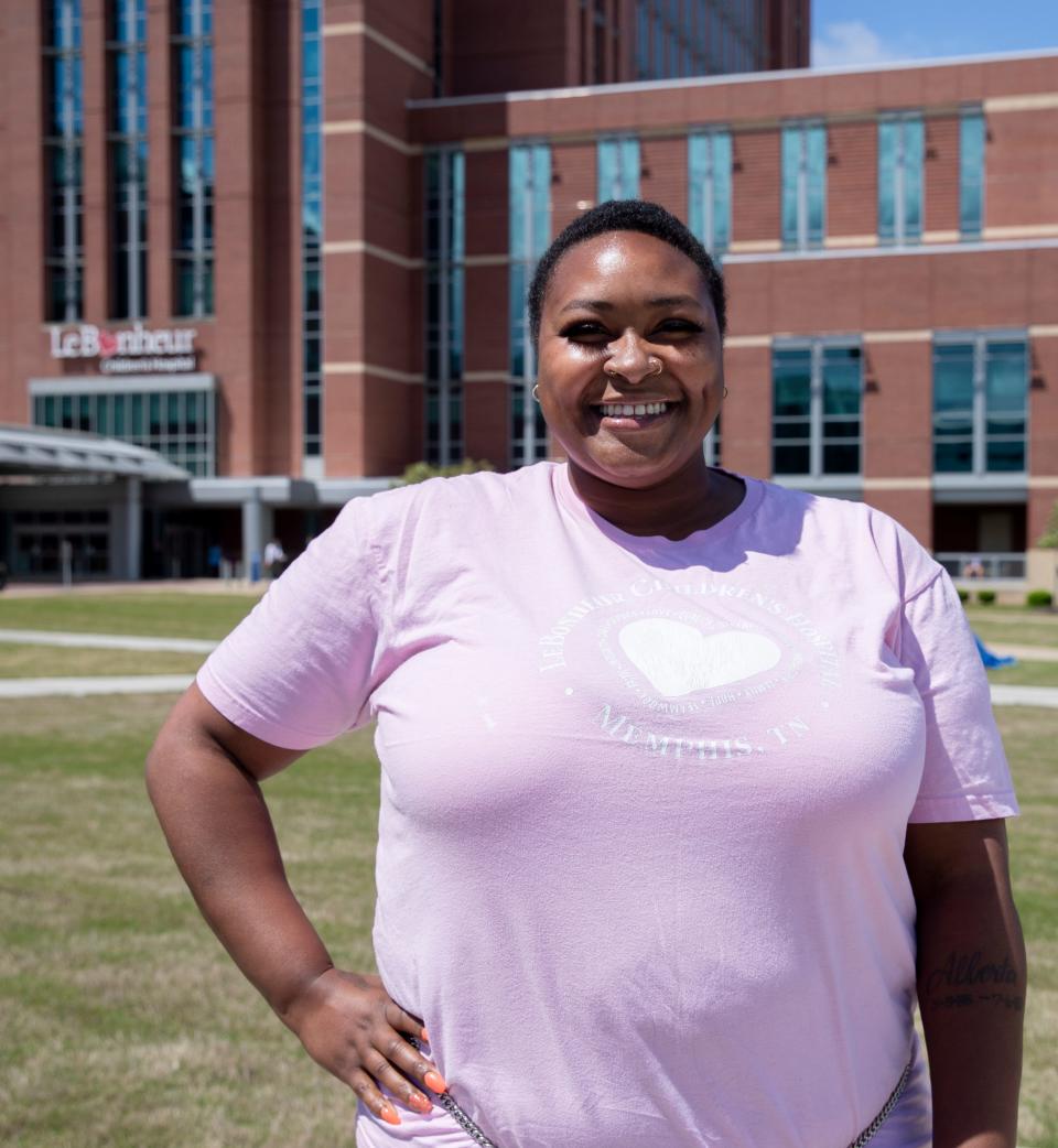 Anjelica Parker stands outside Le Bonheur Children's Hospital on May 6, 2022, in Memphis. Parker works at the hospital after going through a local program that takes underemployed medical district residents and helps upskill them for jobs. 