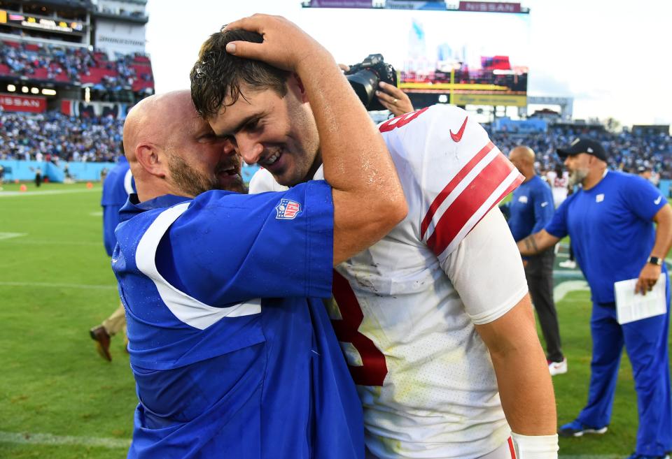 New York Giants head coach Brian Daboll celebrates with quarterback Daniel Jones (8) after a win against the Tennessee Titans at Nissan Stadium.