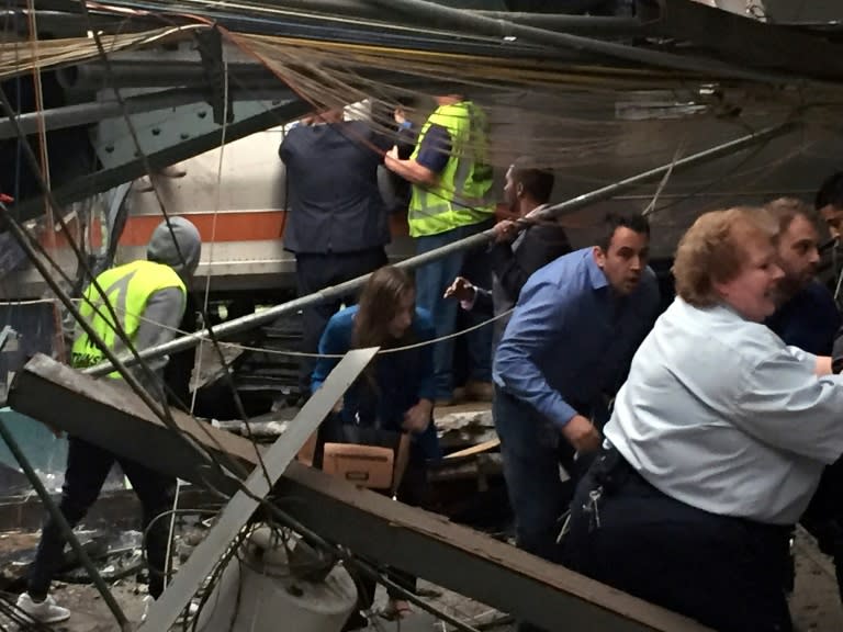 Passengers rush to safety after a NJ Transit train crashed in to the platform at the Hoboken Terminal on September 29, 2016