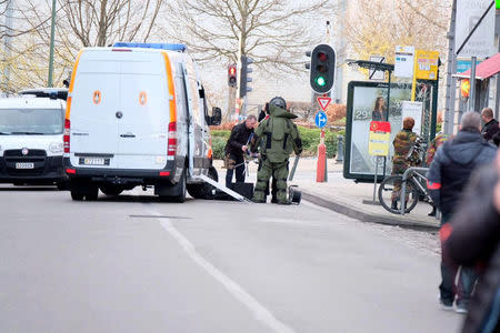 A member of the bomb disposal unit stands in an area of central Brussels on Thursday while bomb disposal experts checked a vehicle carrying gas bottles, a police spokeswoman told local media, in Brussels, Belgium March 2, 2017. REUTERS/Marc Baert