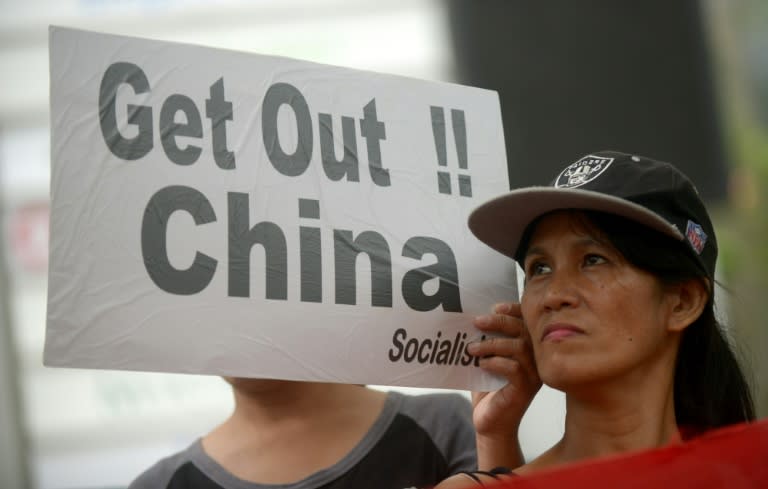 Protesters rally outside the Chinese Consulate in Manila on July 10, 2015, denouncing China's claim to most of the South China Sea including areas claimed by the Philippines