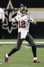 Tampa Bay Buccaneers quarterback Tom Brady (12) works against the New Orleans Saints during the first half of an NFL divisional round playoff football game, Sunday, Jan. 17, 2021, in New Orleans. (AP Photo/Butch Dill)