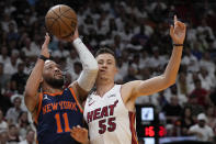 New York Knicks guard Jalen Brunson (11) goes up for a shot against Miami Heat forward Duncan Robinson (55) during the first half of Game 3 of an NBA basketball second-round playoff series, Saturday, May 6, 2023, in Miami. (AP Photo/Wilfredo Lee)