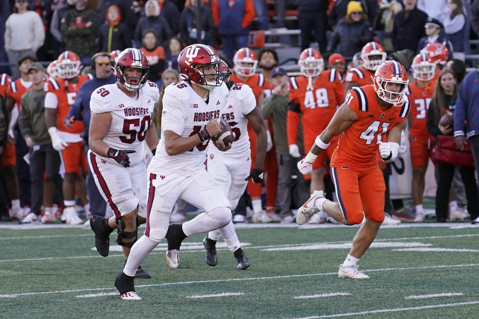 Indiana quarterback Brendan Sorsby carries the ball for a big gain late in the second half of an NCAA college football game against Illinois on Saturday, Nov. 11, 2023, in Champaign, Ill. (AP Photo/Charles Rex Arbogast)