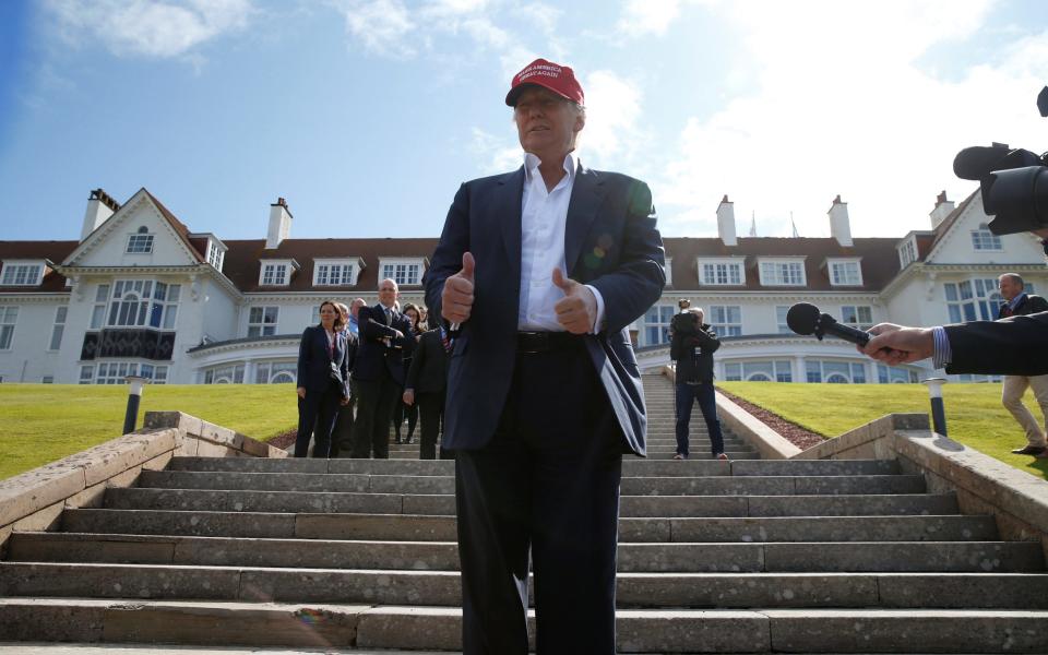 Donald Trump gestures as he stands in front of the Turnberry hotel during the Women's British Open golf championship at the Turnberry golf club in Turnberry, Scotland, Britain July 30, 2015 - Credit: Reuters