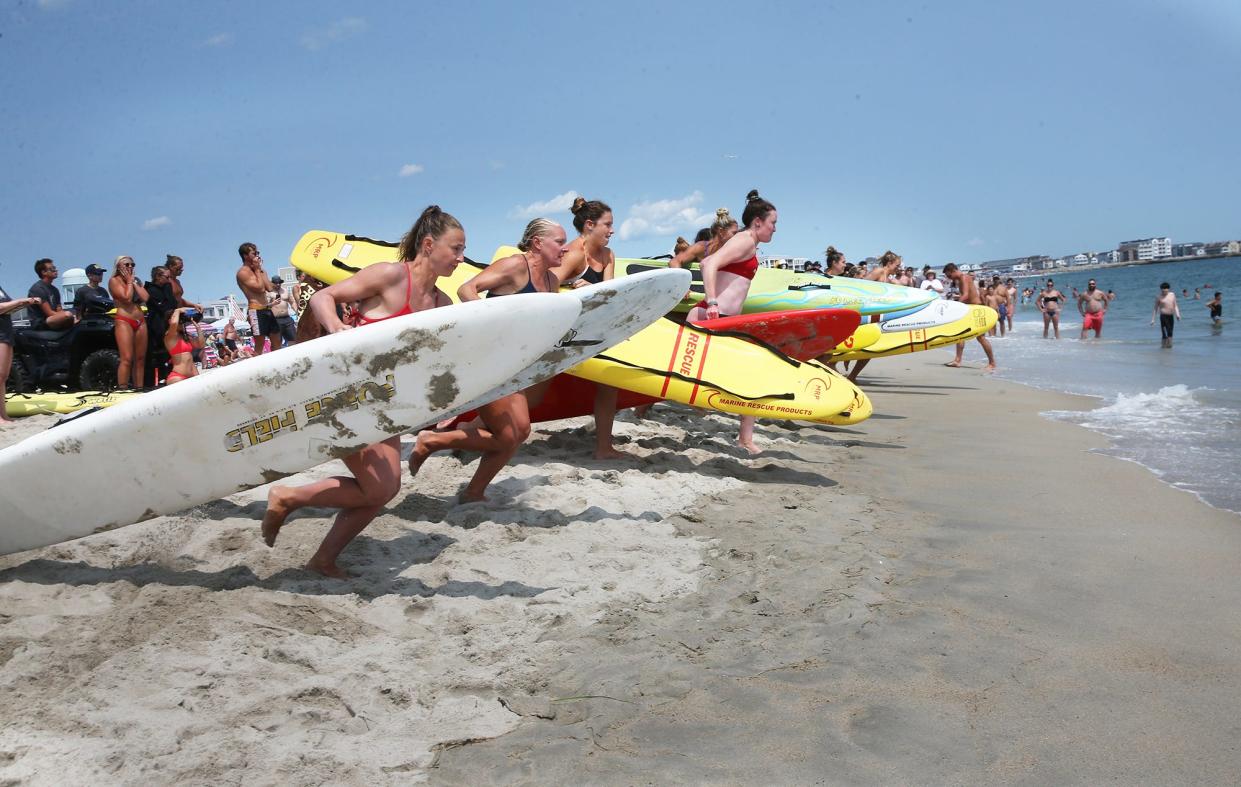 Female lifeguards begin the 500 meters longboard contest in the 2023 New England Lifesaving Championship held in Hampton Aug. 3, 2023.