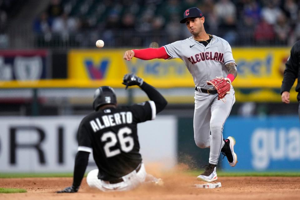 Cleveland Guardians shortstop Brayan Rocchio throws to first after forcing out Chicago White Sox's Hanser Alberto at second, getting Tim Anderson at first for a double play May 17 in Chicago.