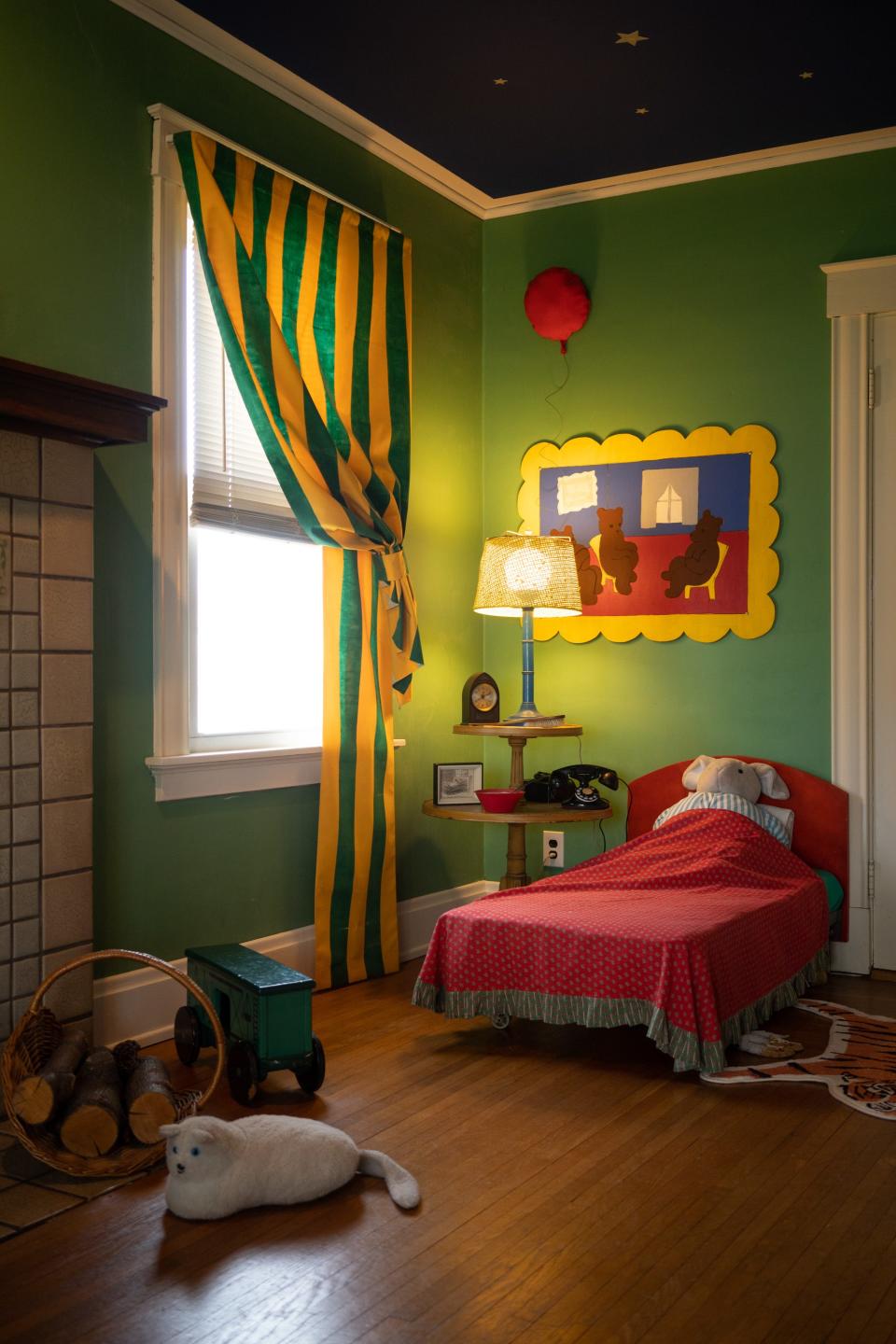 The telephone, red balloon, picture of three little bears sitting on chairs in the Great Green Room inspired by "Goodnight Moon."