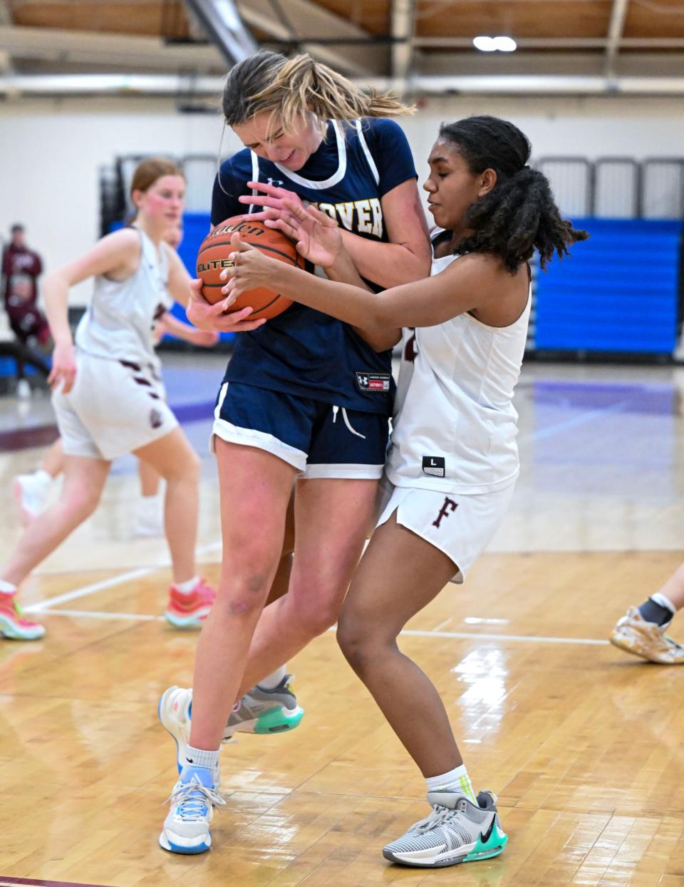 FALMOUTH 02/12/24 Laylla Clunes of Falmouth tie up Mary Kate Flynn of Hanover. girls basketball
Ron Schloerb/Cape Cod Times