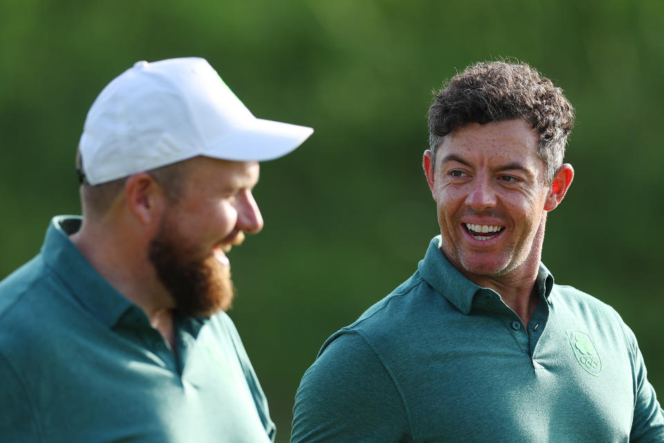 PARIS, FRANCE - JULY 30: Shane Lowry and Rory McIlroy of Team Ireland interact on the third hole during a practice round ahead of the Men's Individual Stroke Play on day four of the Olympic Games Paris 2024 at Le Golf National on July 30, 2024 in Paris, France. (Photo by Andrew Redington/Getty Images)