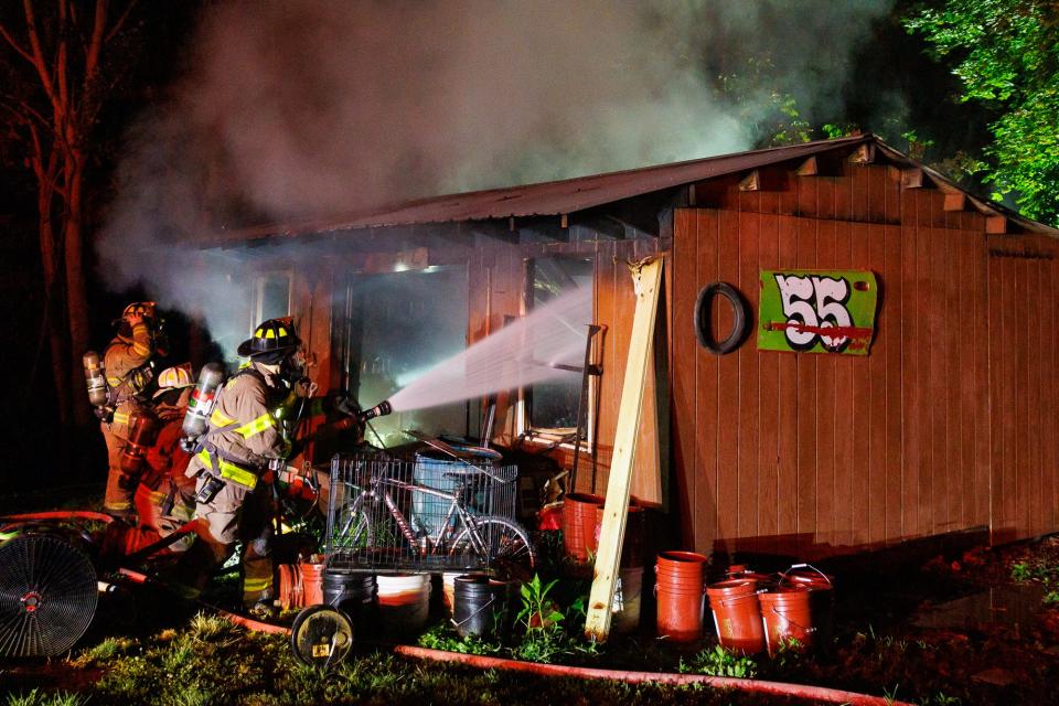 Firefighters work at the scene of a working garage fire on the 2600 block of Wilkens Lane, Saturday, July 27, 2024, in Codorus Township.